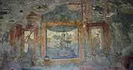 Close-up of the west wall showing the stage structure photograph