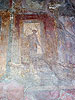 Close-up detail of the right stepped entranceway with theatrical mask photograph